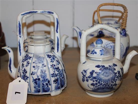 Four Chinese blue & white wine pots (one with cane handle)